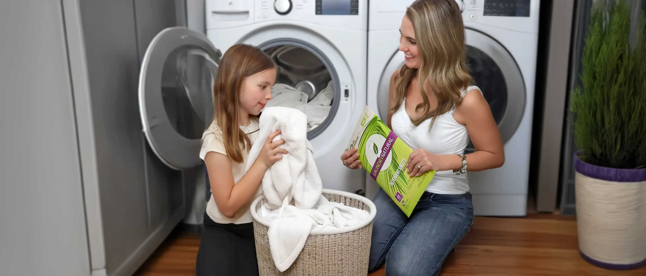 Washing towels with daughter using LaundryNatural laundry detergent sheets